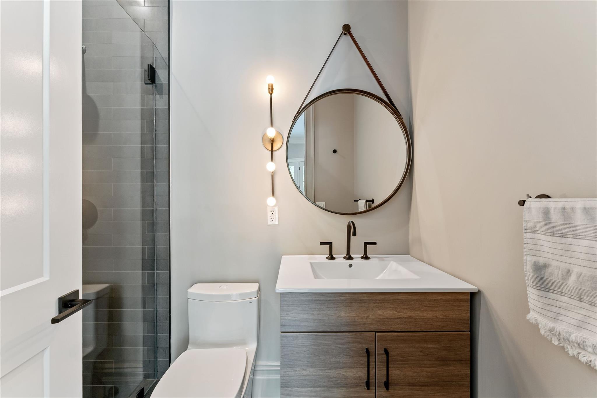 17 Oxford Road Scarsdale, NY 10583 - Photo 19 of 49 a bathroom with a sink a toilet and a mirror