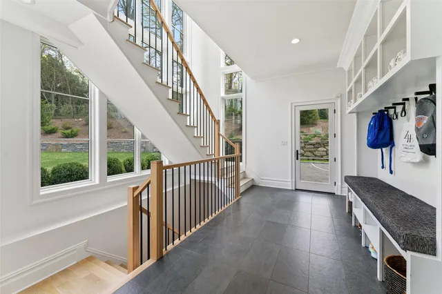 a view of entryway and hall with wooden floor