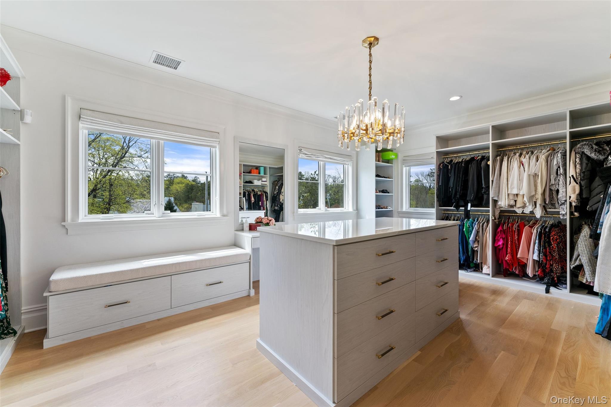 17 Oxford Road Scarsdale, NY 10583 - Photo 22 of 49 1 of 2 walk in closets with custom cabinetry and island