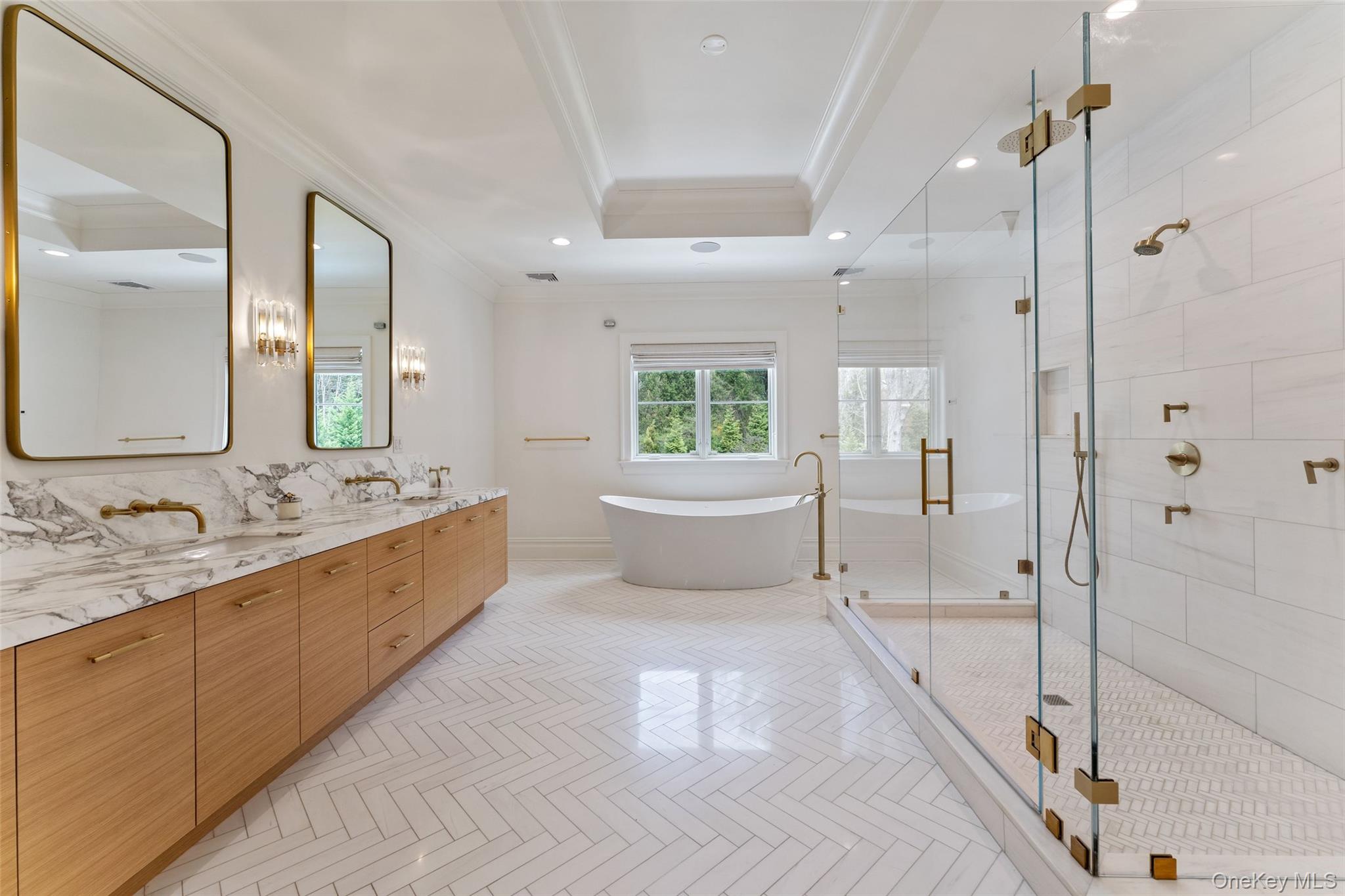 17 Oxford Road Scarsdale, NY 10583 - Photo 23 of 49 Primary bathroom with double vanity, soaking tub, radiant heated floors and frameless glass rain shower for two!