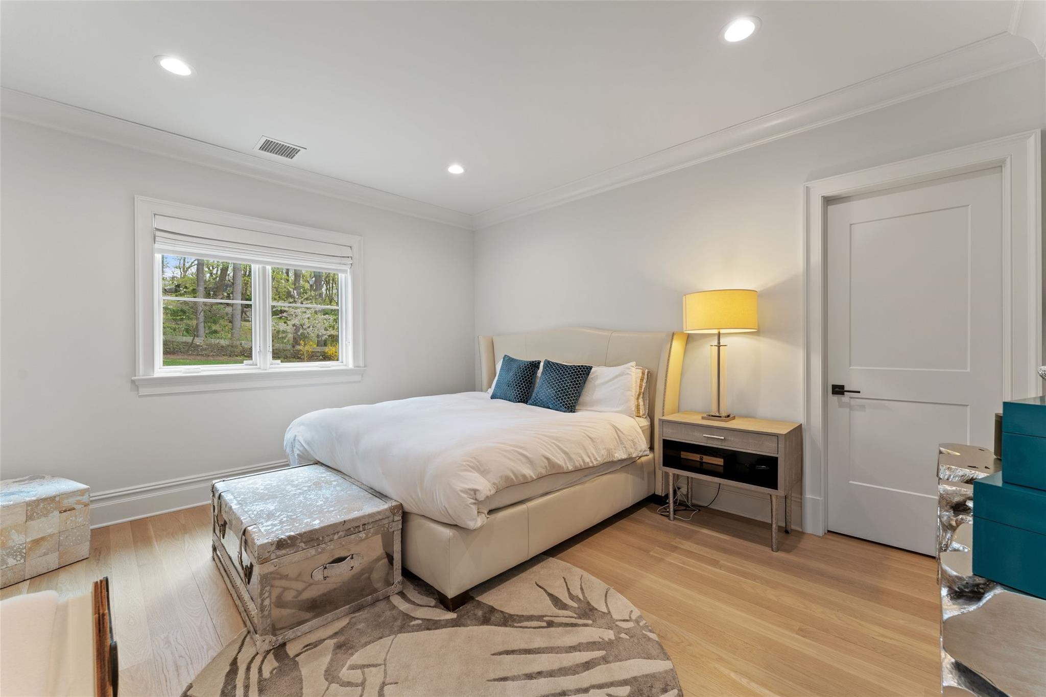 17 Oxford Road Scarsdale, NY 10583 - Photo 28 of 49 a bedroom with a bed and wooden floor