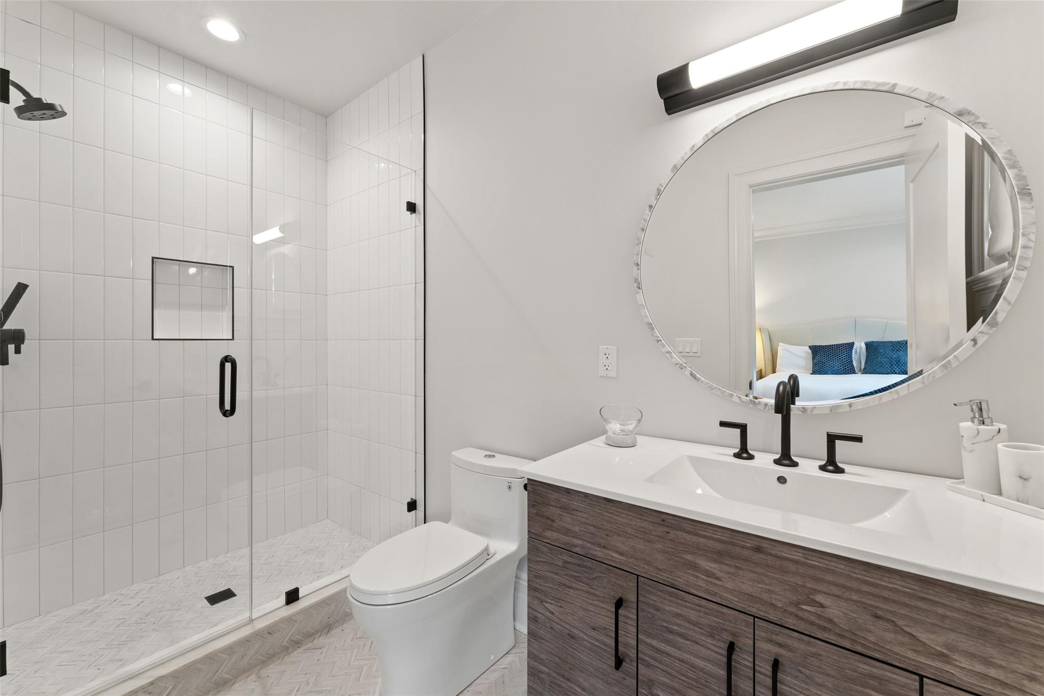 17 Oxford Road Scarsdale, NY 10583 - Photo 29 of 49 a bathroom with a sink a toilet and shower