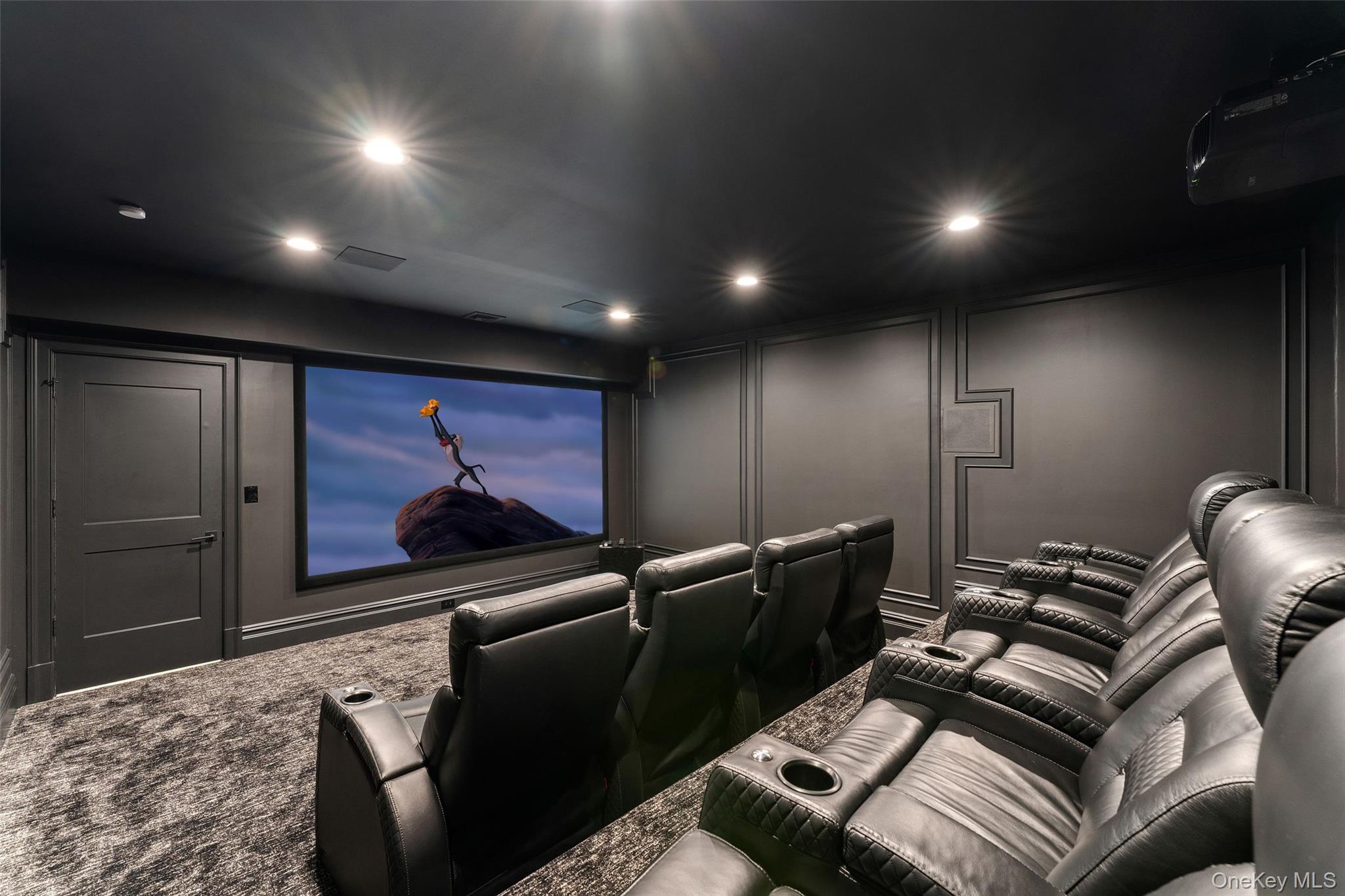 17 Oxford Road Scarsdale, NY 10583 - Photo 32 of 49 Home Theatre featuring stadium seating and a cinema quality AV system