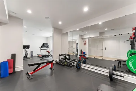 a living room with lots of gym equipment