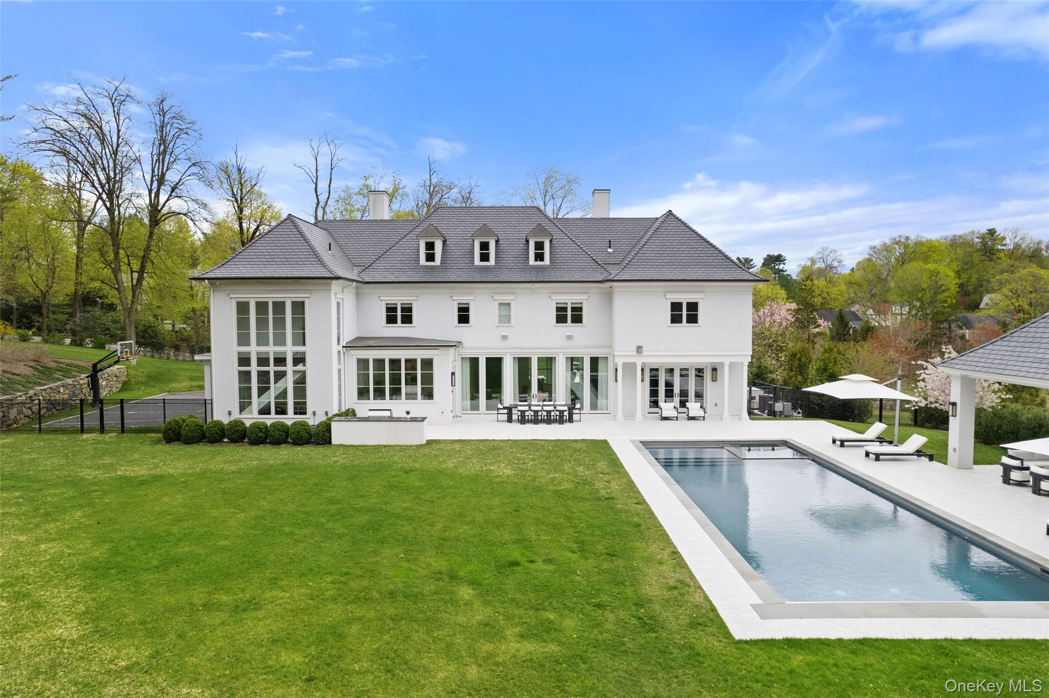 17 Oxford Road Scarsdale, NY 10583 - Photo 36 of 49 View of back of house with 20X50 Salt Water Pool
