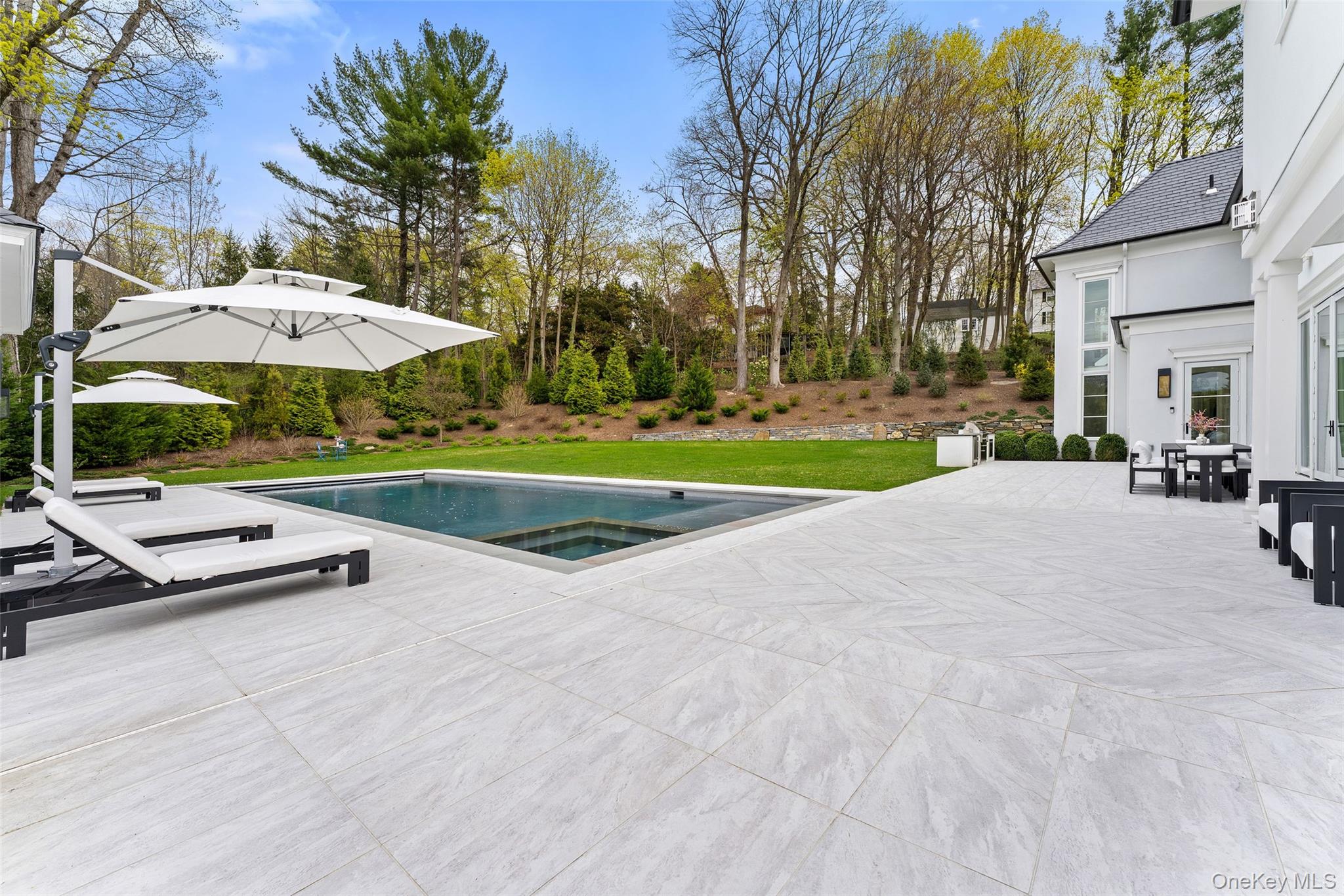 17 Oxford Road Scarsdale, NY 10583 - Photo 39 of 49 2000 square foot patio with porcelain tile pavers