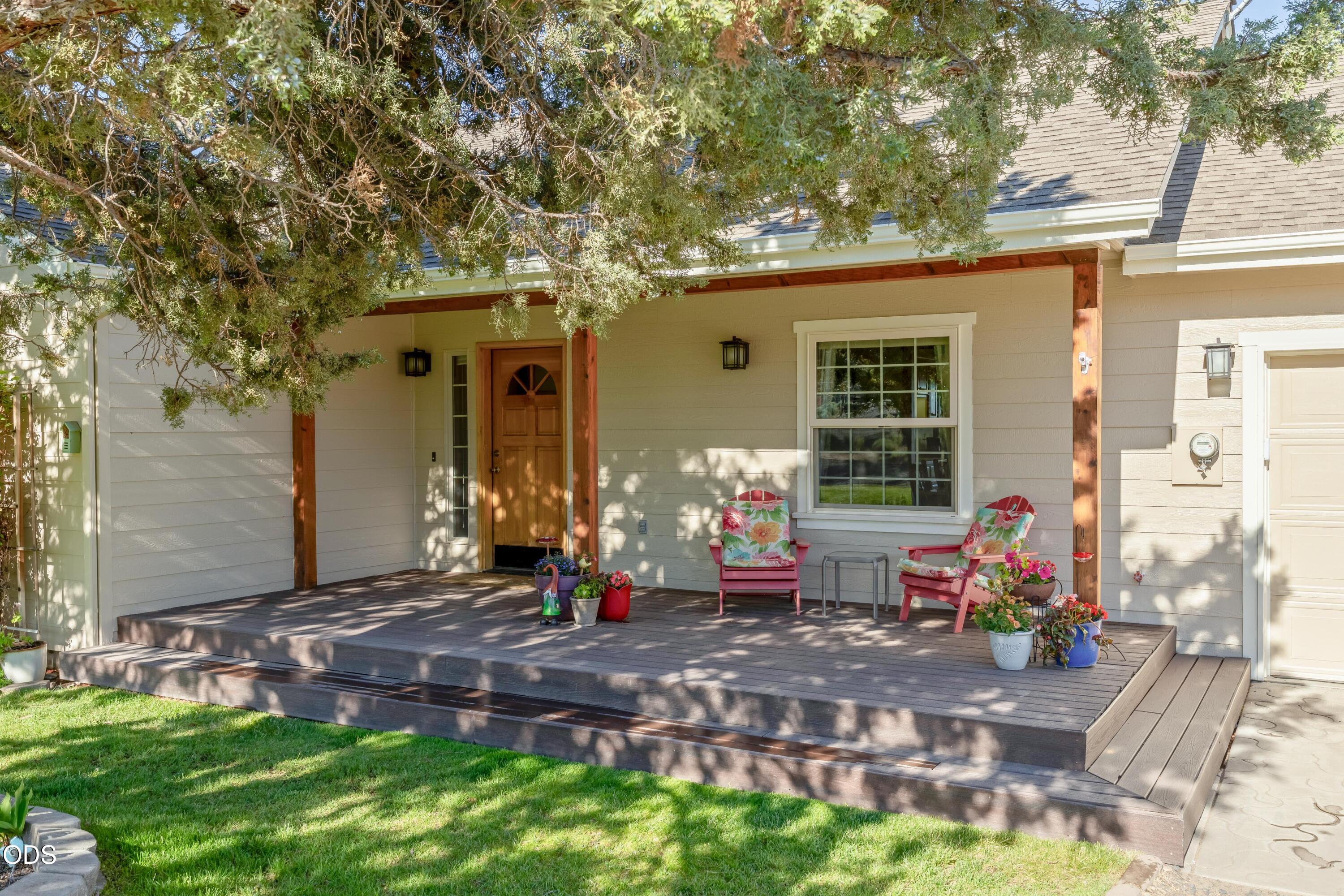 13753 South Sego Lily Road Powell Butte, OR 97753 - Photo 2 of 46 a front view of house with yard outdoor seating and green space
