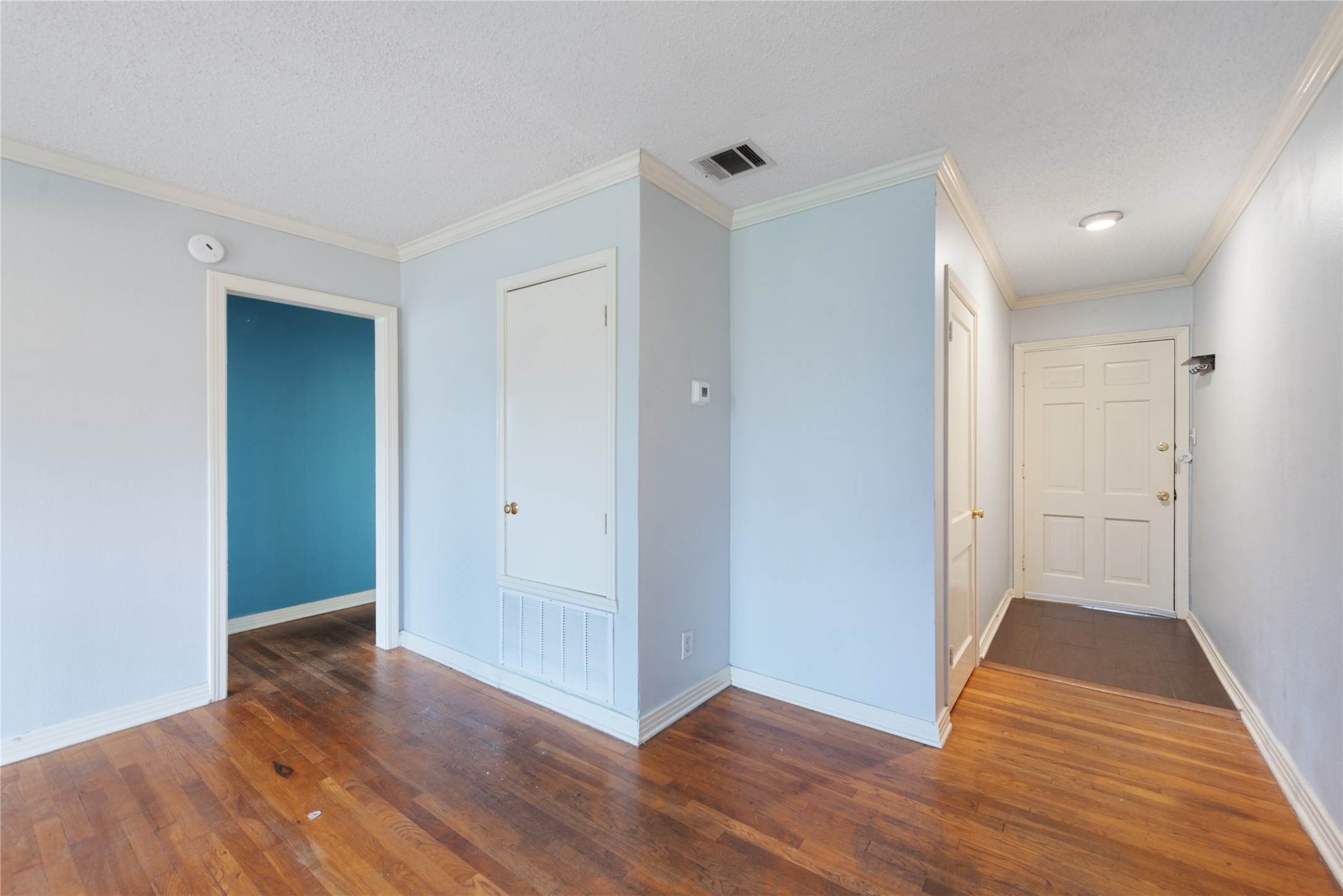 1900 Justin Lane Austin, TX 78757 - Photo 14 of 27 Corridor with ornamental molding and dark wood-style floors