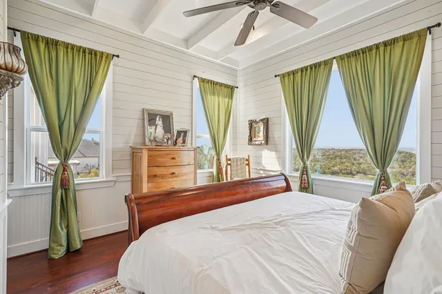 a view of walk in closet with clothes