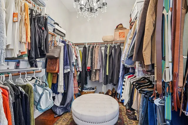 a bathroom with a granite countertop tub sink and mirror