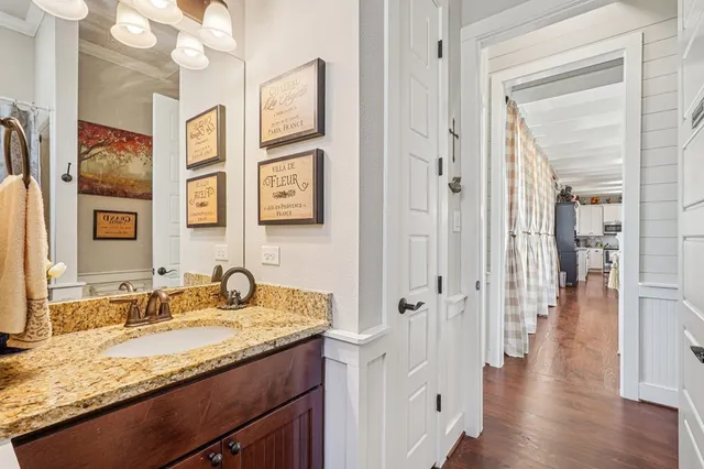 a living room with furniture and a ceiling fan