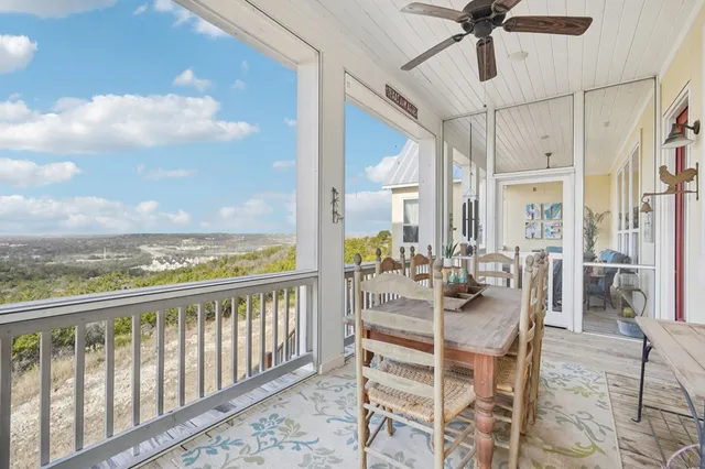 a view of a balcony with couch and a potted plant