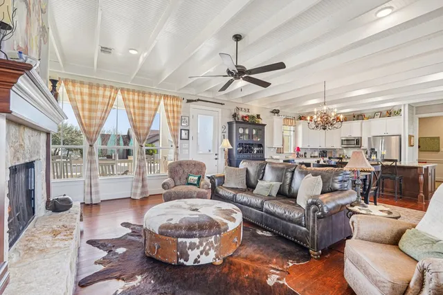 a living room with furniture and a fireplace