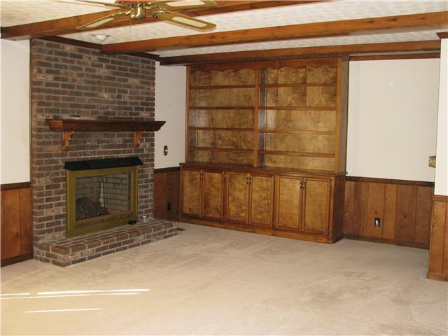 307 Mosley Drive Springfield, TN 37172 - Photo 7 of 14 What a great den! Exposed beams, built-in bookshelves, a brick fireplace w/gas logs, access to the rear patio & it's on the MAIN LEVEL!