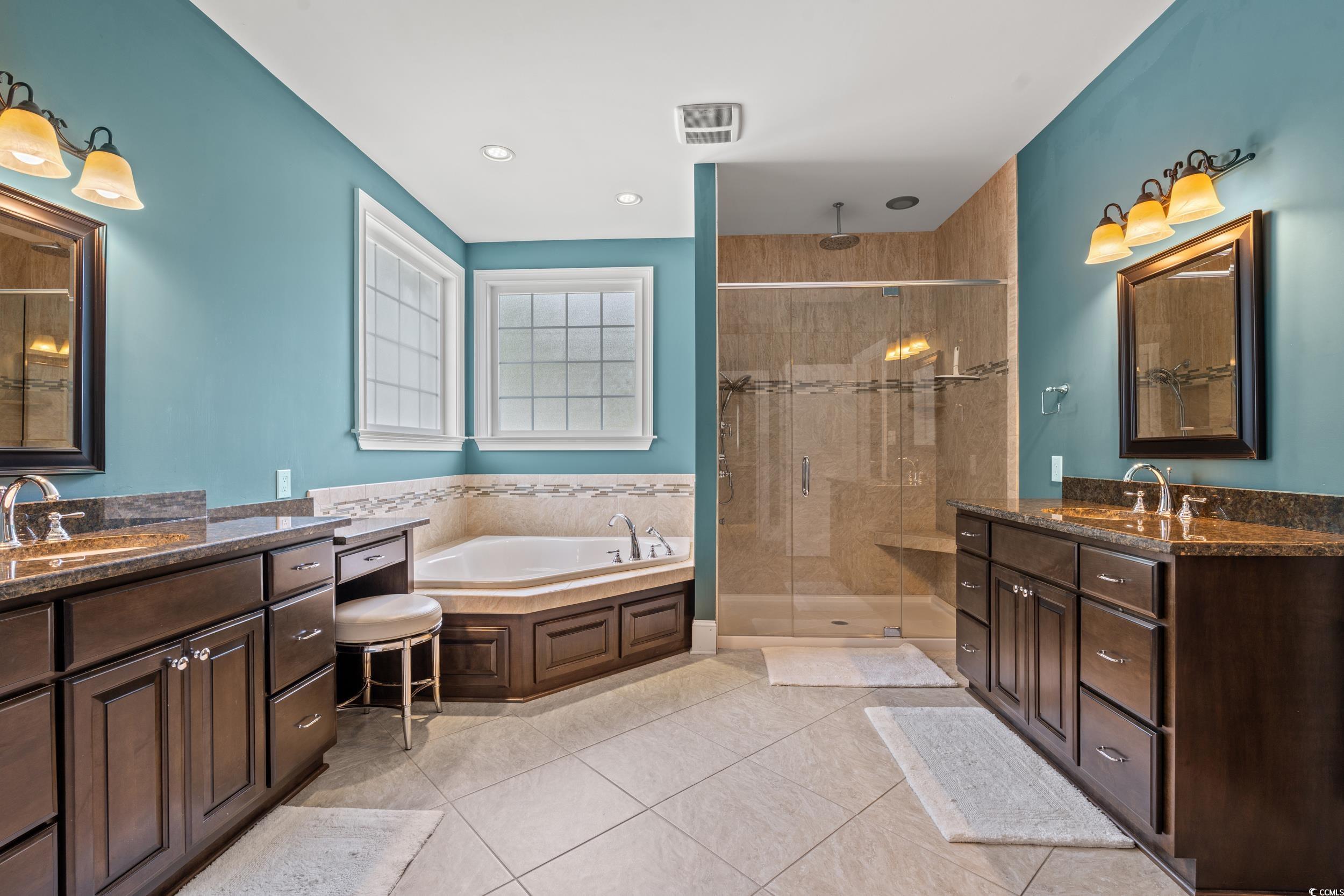 3609 Long Ave Extension Conway, SC 29526 - Photo 19 of 40 Bathroom with a shower stall, a garden tub, light tile patterned flooring, two vanities, and recessed lighting