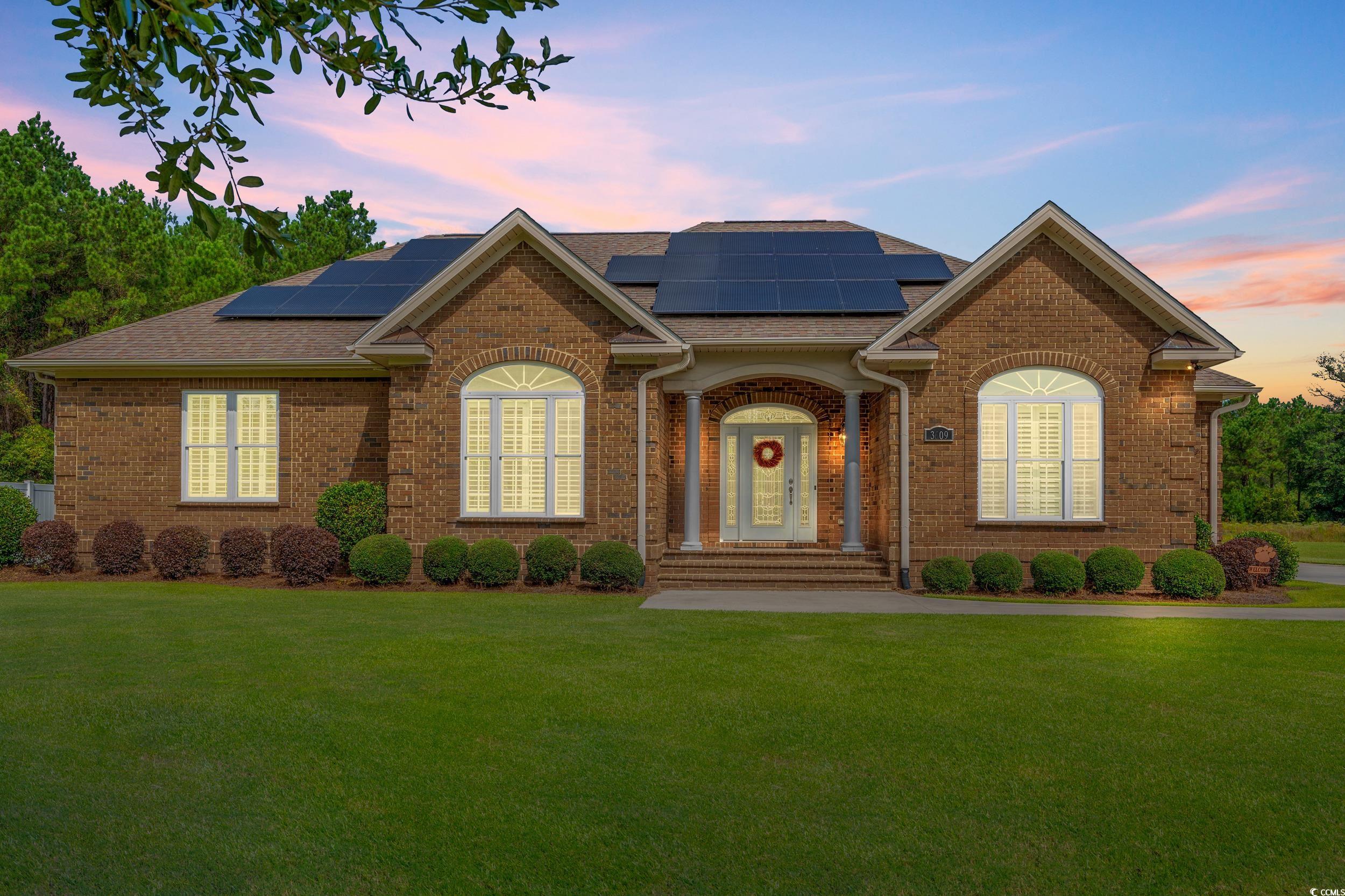 3609 Long Ave Extension Conway, SC 29526 - Photo 2 of 40 Ranch-style house featuring a shingled roof, brick siding, and a lawn