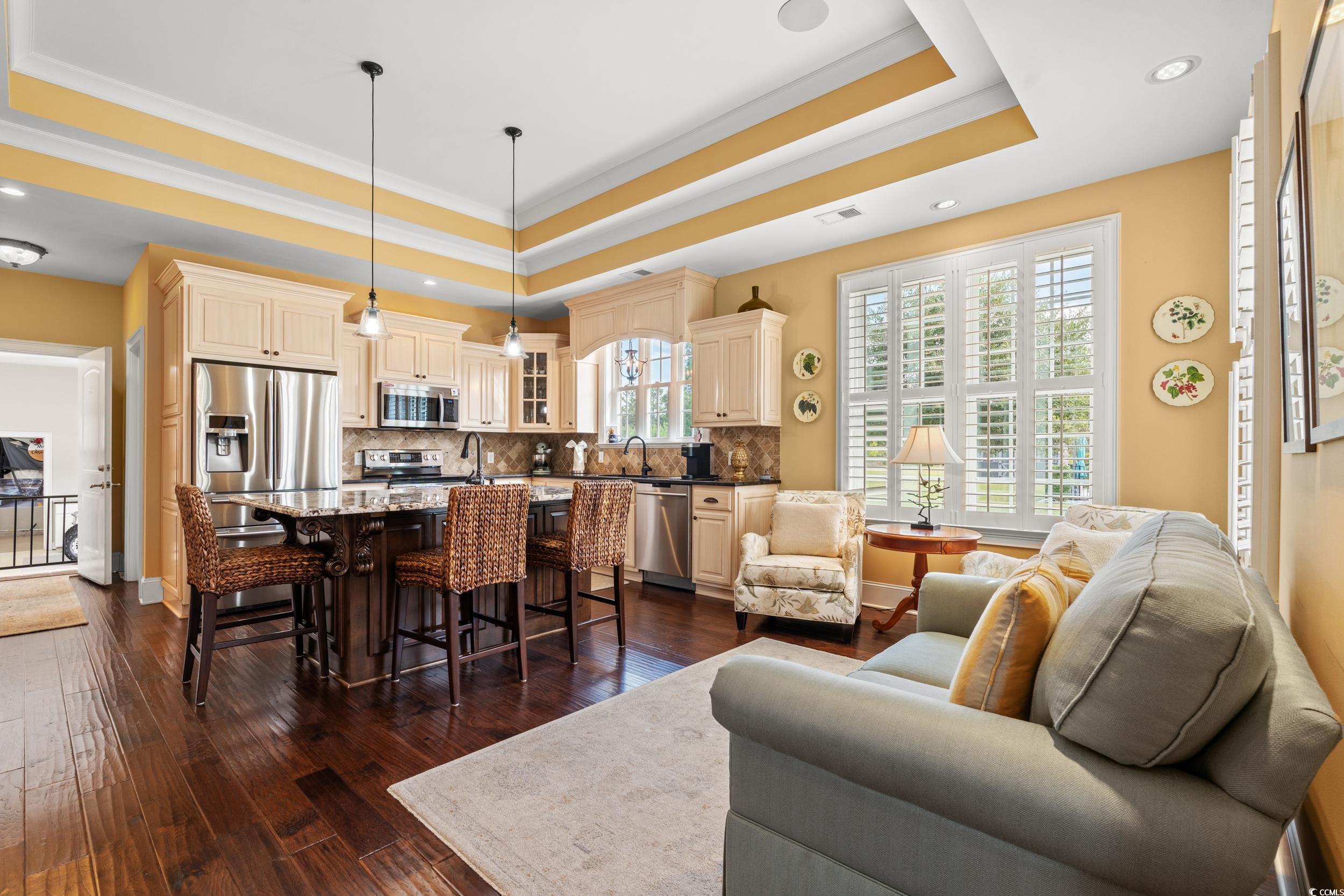 3609 Long Ave Extension Conway, SC 29526 - Photo 10 of 40 Kitchen area with a raised ceiling, dark wood-style flooring, recessed lighting, and ornamental molding