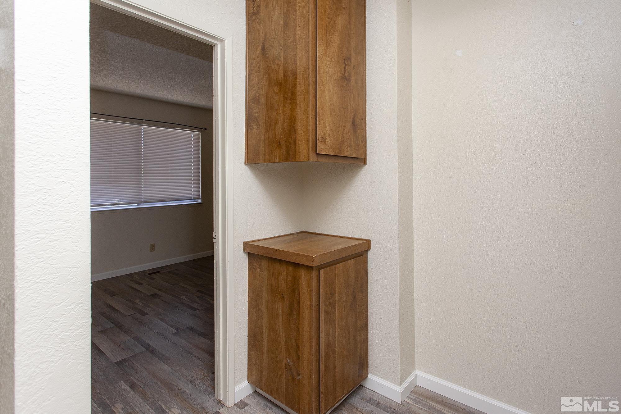 10046 Humite Lane Reno, NV 89506 - Photo 14 of 17 a view of walk in closet with wooden floor