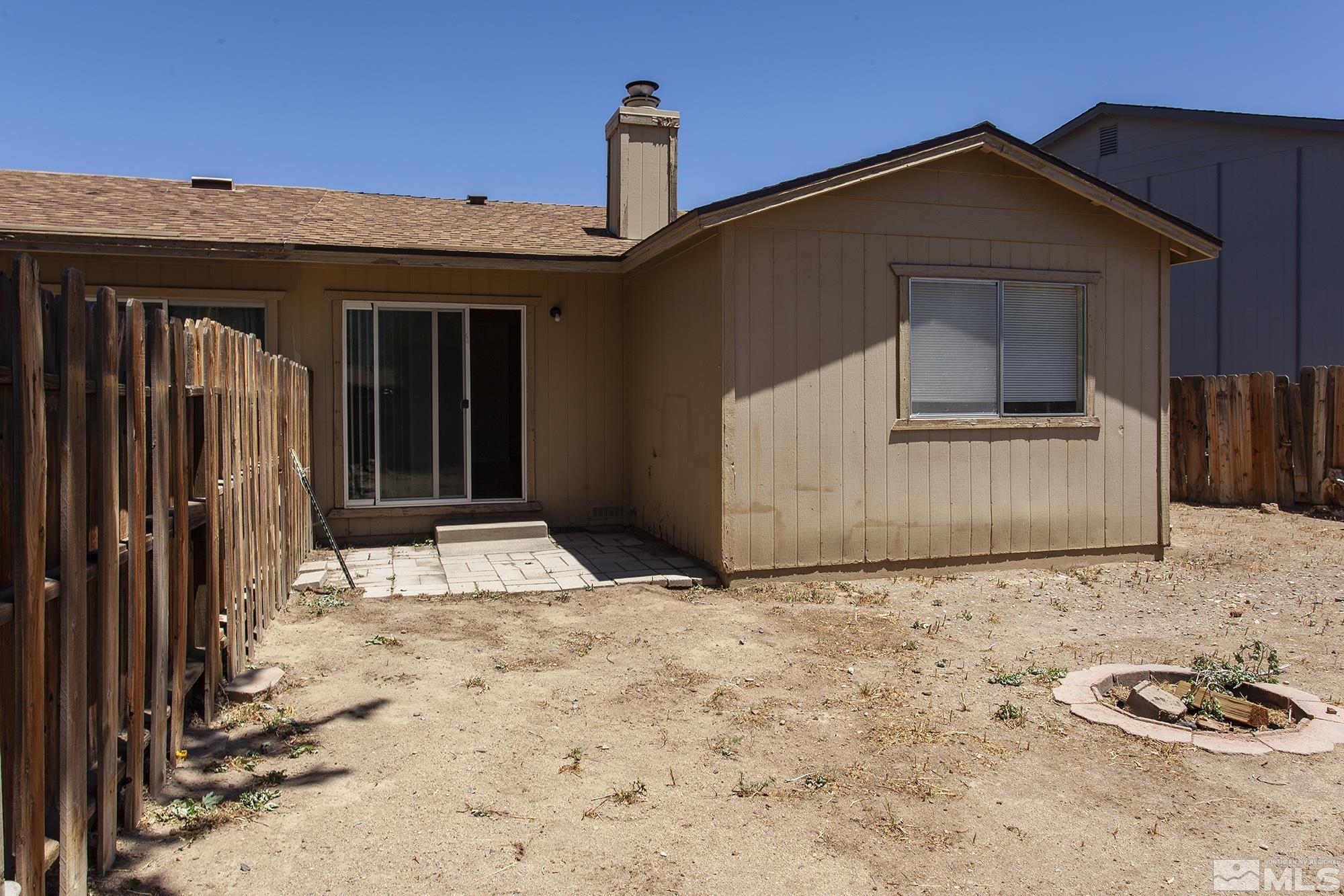 10046 Humite Lane Reno, NV 89506 - Photo 17 of 17 a front view of a house with a yard