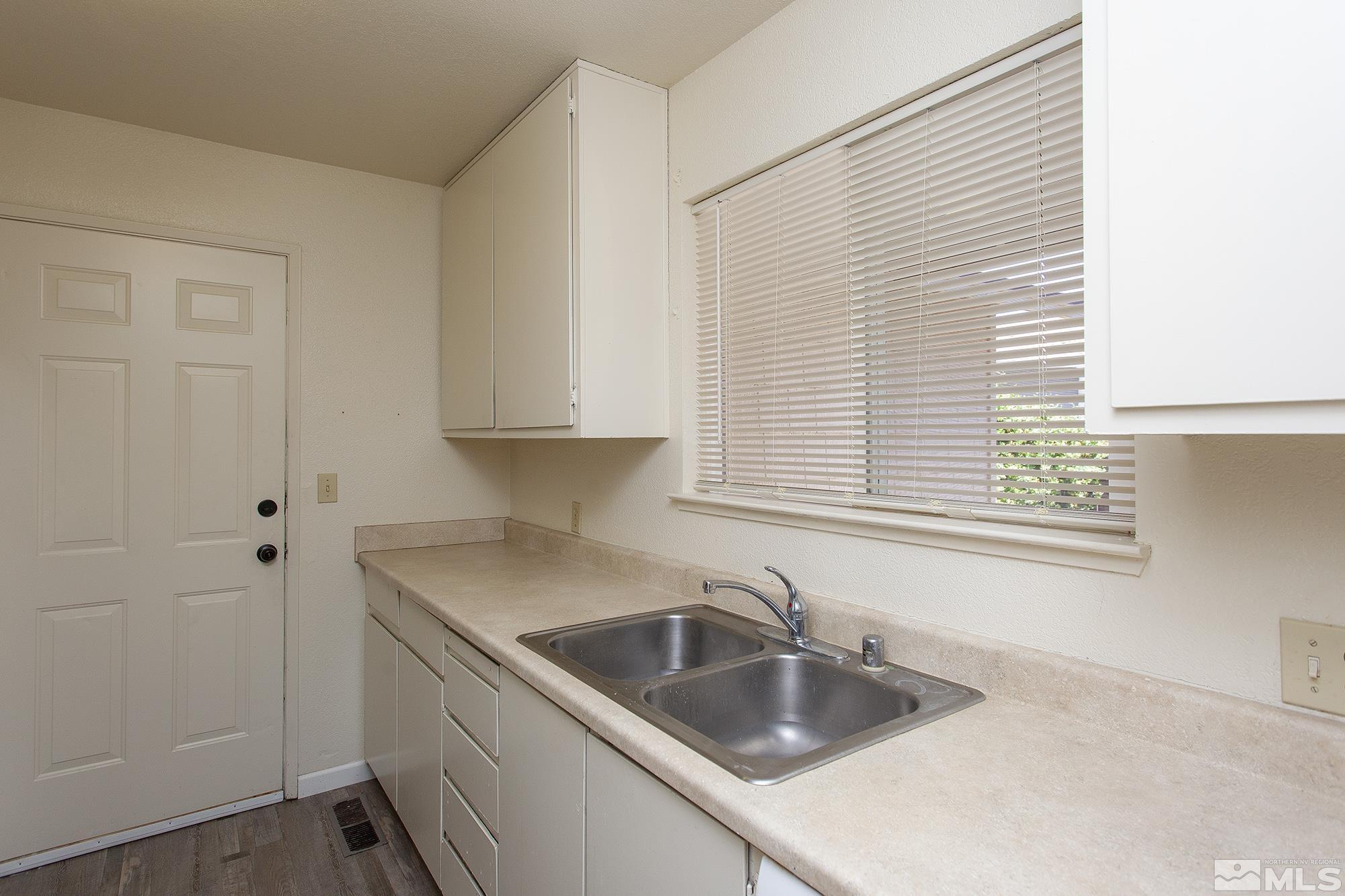 10046 Humite Lane Reno, NV 89506 - Photo 5 of 17 a kitchen with a sink cabinets and a window