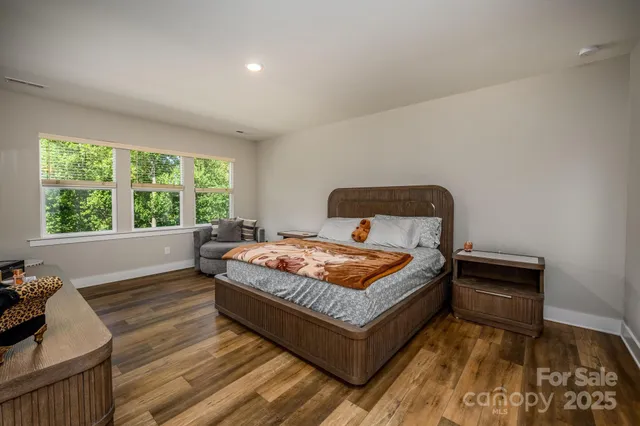 a bedroom with a bed and window