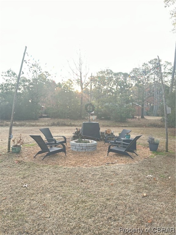 View of yard featuring a fire pit