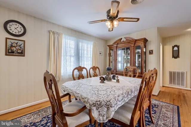 a view of a dining room with furniture and window