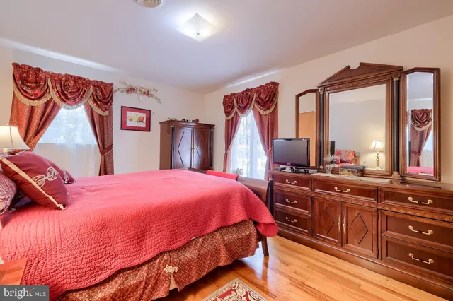 a bedroom with a bed and a dresser