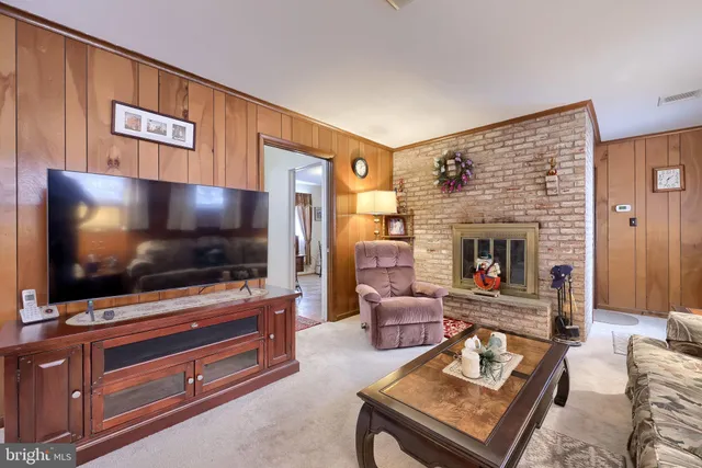 a view of a hallway with entryway wooden floor and front door