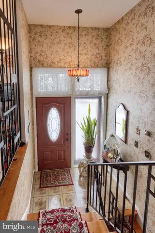 a view of a entryway door with wooden floor