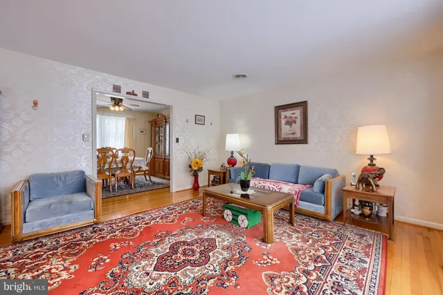 a living room with furniture and a rug