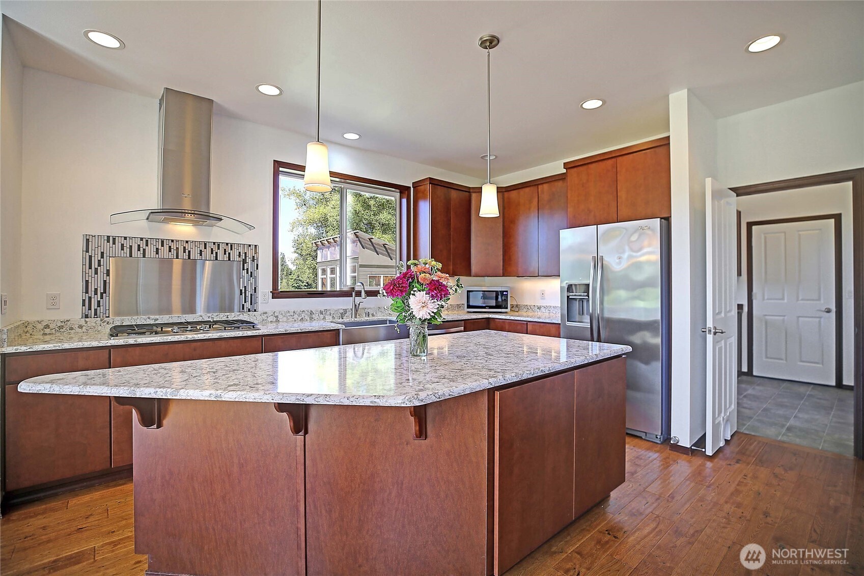 12631 State Rte 530 Northeast Arlington, WA 98223 - Photo 13 of 40 a kitchen with stainless steel appliances granite countertop sink stove and refrigerator