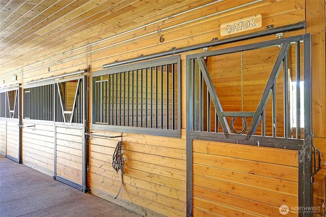 a view of a blue house with a outdoor space