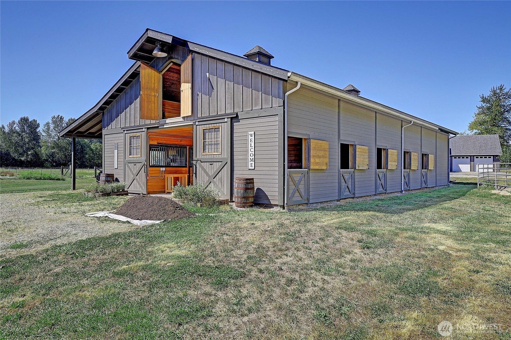 12631 State Rte 530 Northeast Arlington, WA 98223 - Photo 34 of 40 a view of a house with backyard and a tree
