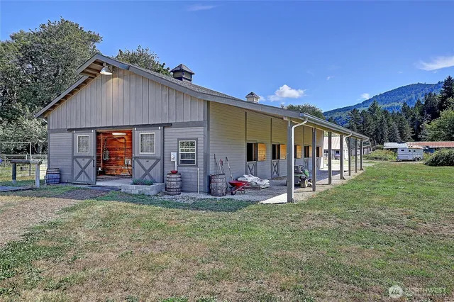 a front view of house with yard and outdoor seating