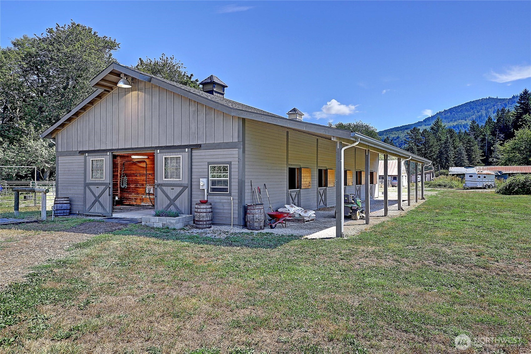 12631 State Rte 530 Northeast Arlington, WA 98223 - Photo 4 of 40 a front view of house with yard and outdoor seating