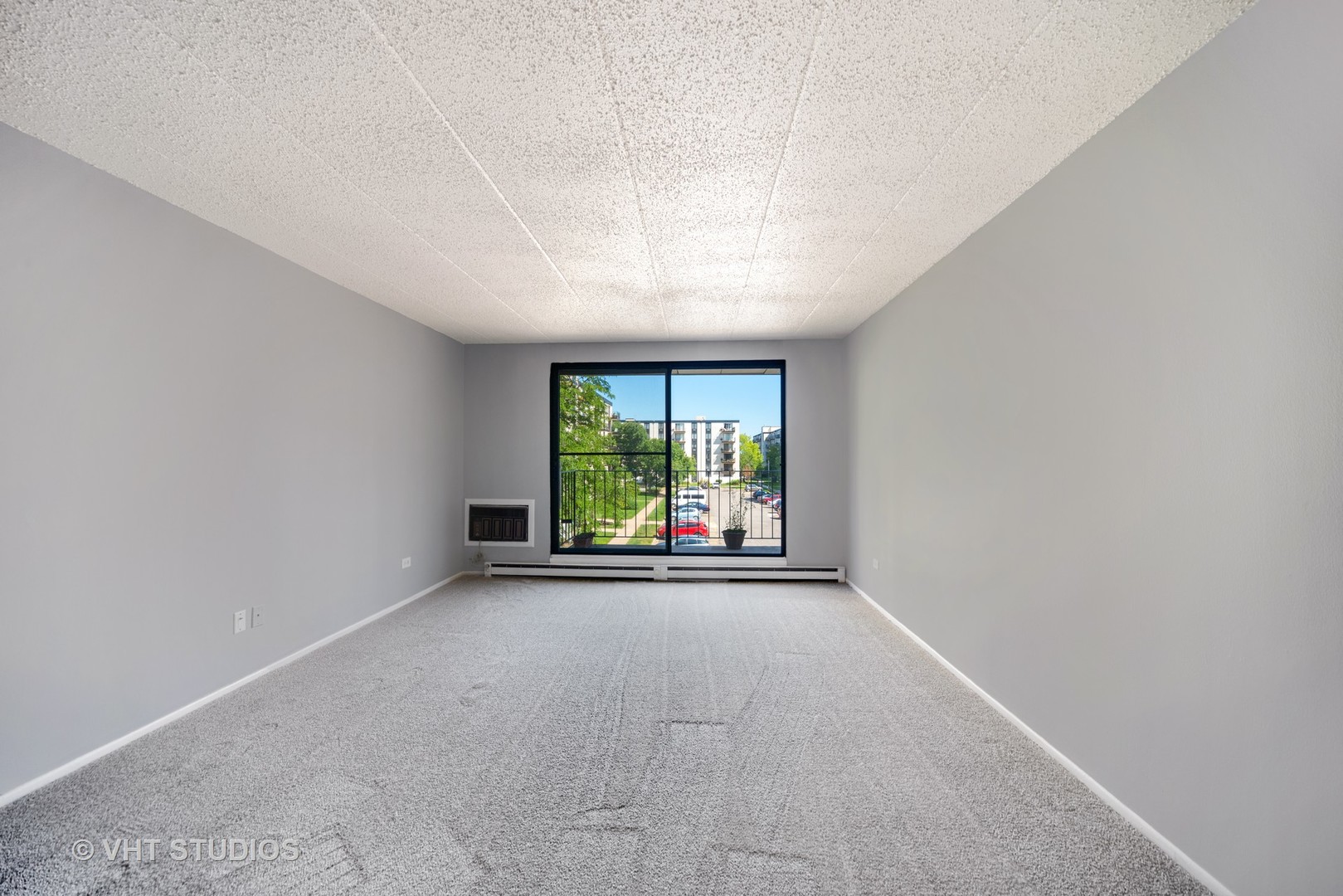 9701 North Dee Road, Unit 3L Niles, IL 60714 - Photo 2 of 10 an empty room with windows