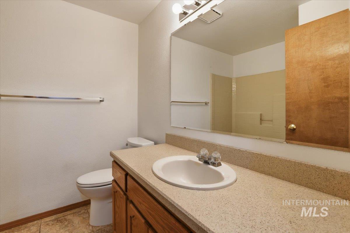 7134 West Amity Road Boise, ID 83709 - Photo 11 of 20 Bathroom featuring vanity and light tile patterned floors