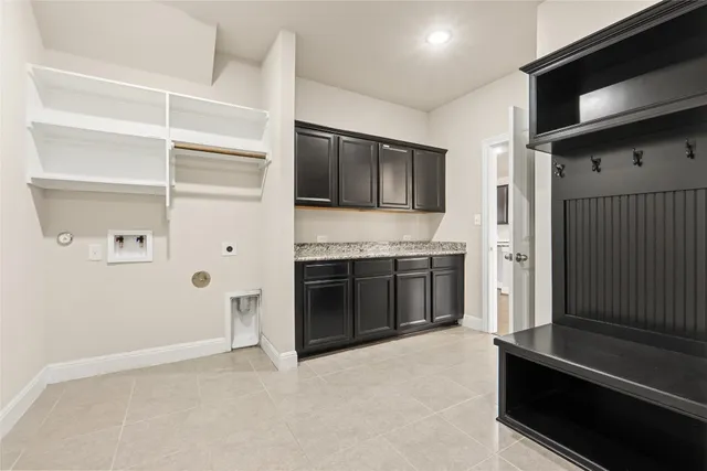 a open kitchen with a stove and a refrigerator