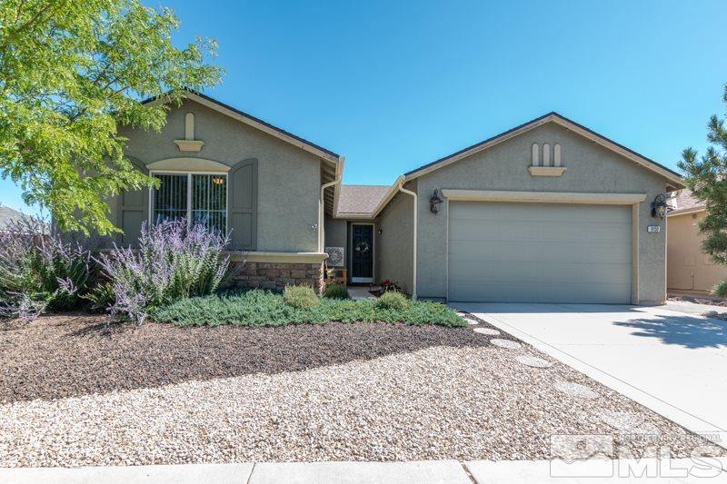 9150 Andraste Way Reno, NV 89506 - Photo 1 of 23 a front view of a house with a yard and garage