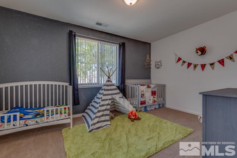 9150 Andraste Way Reno, NV 89506 - Photo 12 of 23 a bed room with furniture and a window