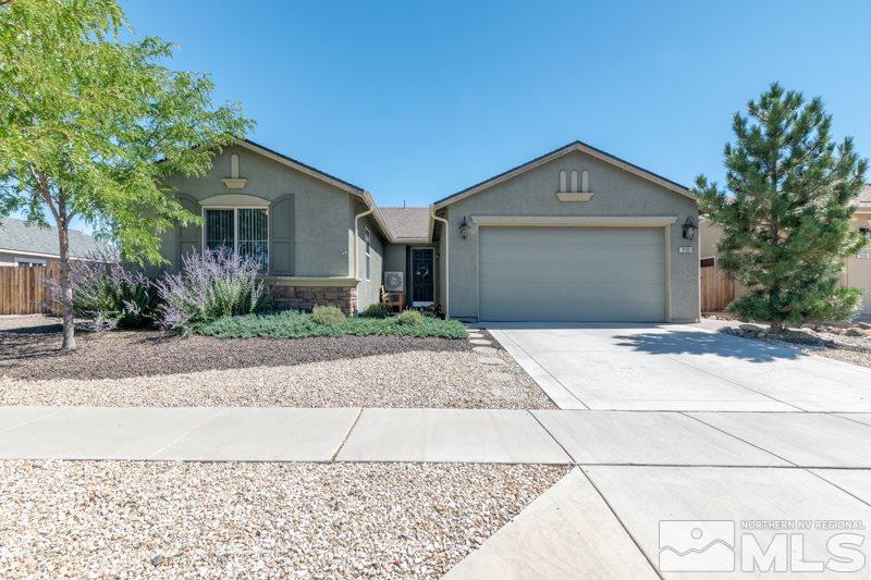 9150 Andraste Way Reno, NV 89506 - Photo 2 of 23 a front view of a house with a yard and garage