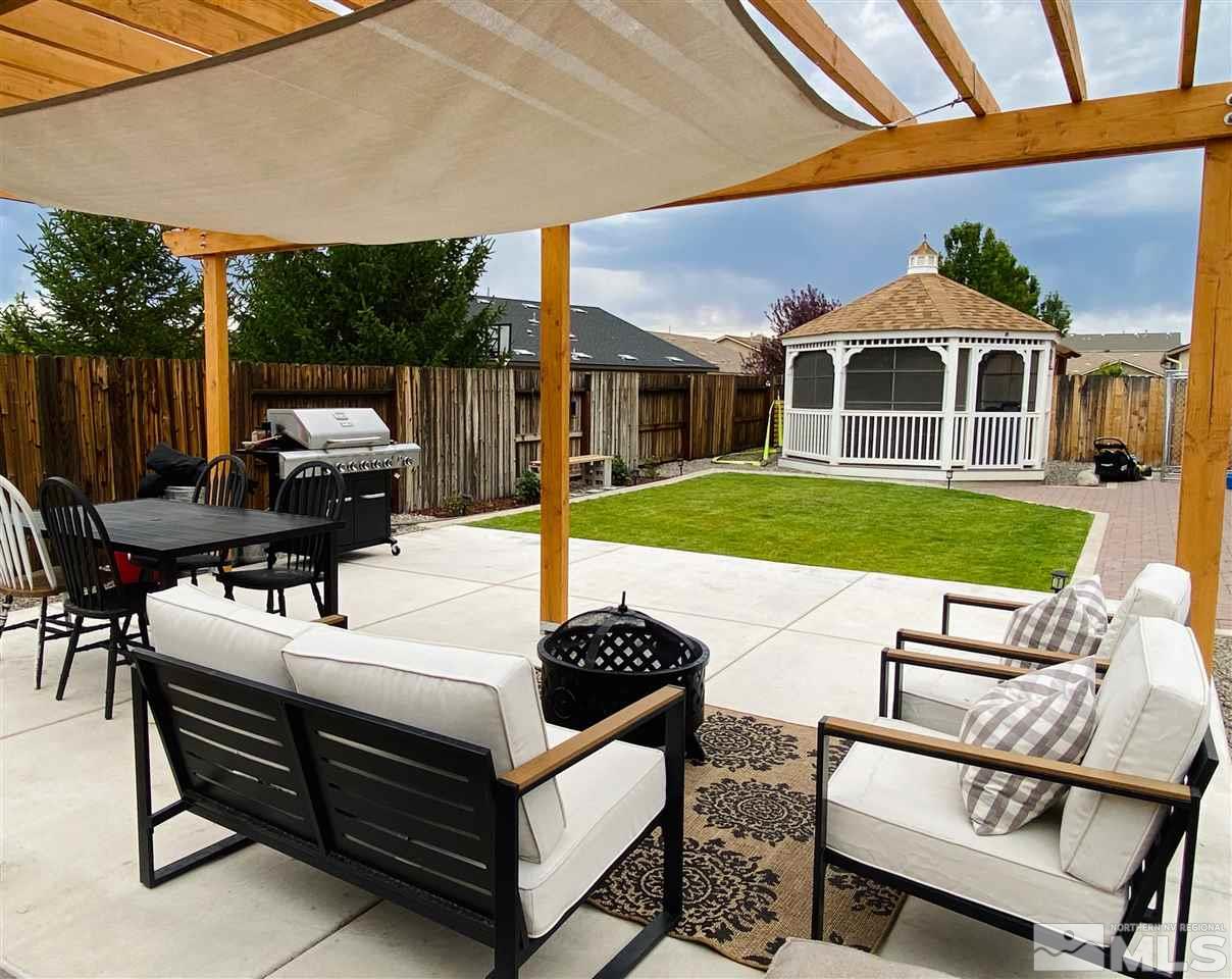 9150 Andraste Way Reno, NV 89506 - Photo 21 of 23 a patio with table and chairs