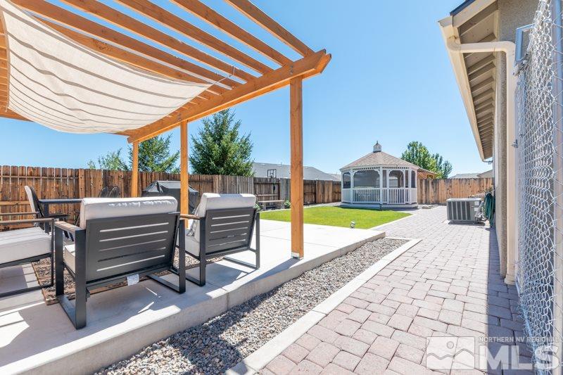 9150 Andraste Way Reno, NV 89506 - Photo 23 of 23 a view of a swimming pool with a patio