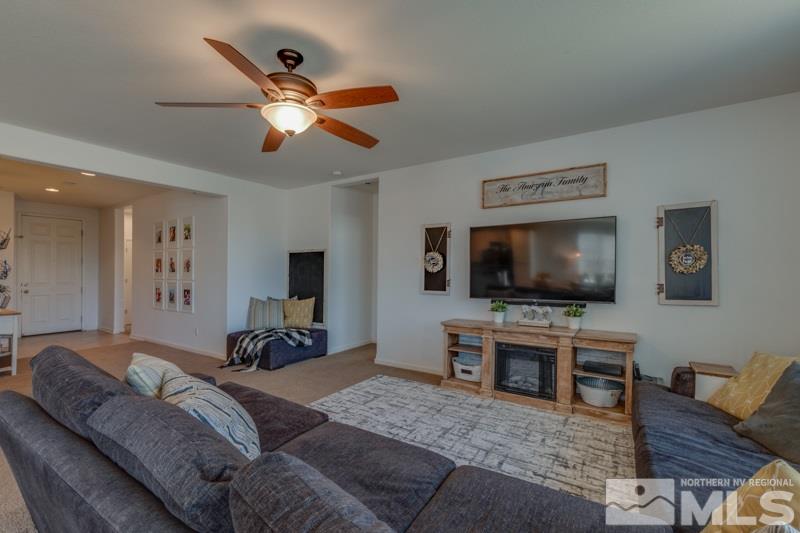9150 Andraste Way Reno, NV 89506 - Photo 6 of 23 a living room with furniture and a flat screen tv