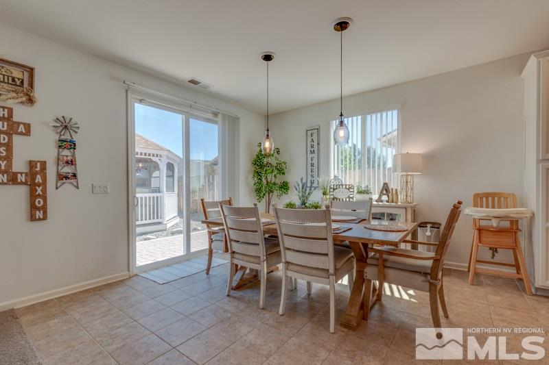 9150 Andraste Way Reno, NV 89506 - Photo 9 of 23 a view of a dining room with furniture window and outside view