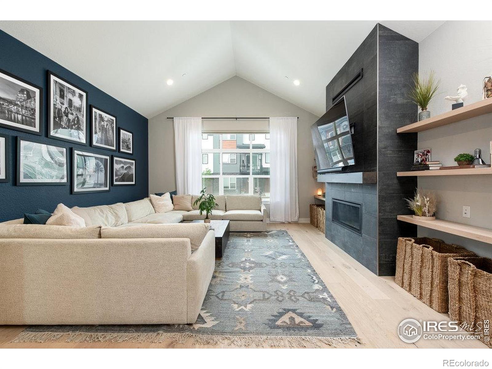 730 Promenade Drive Superior, CO 80027 - Photo 14 of 50 a living room with furniture and a fireplace