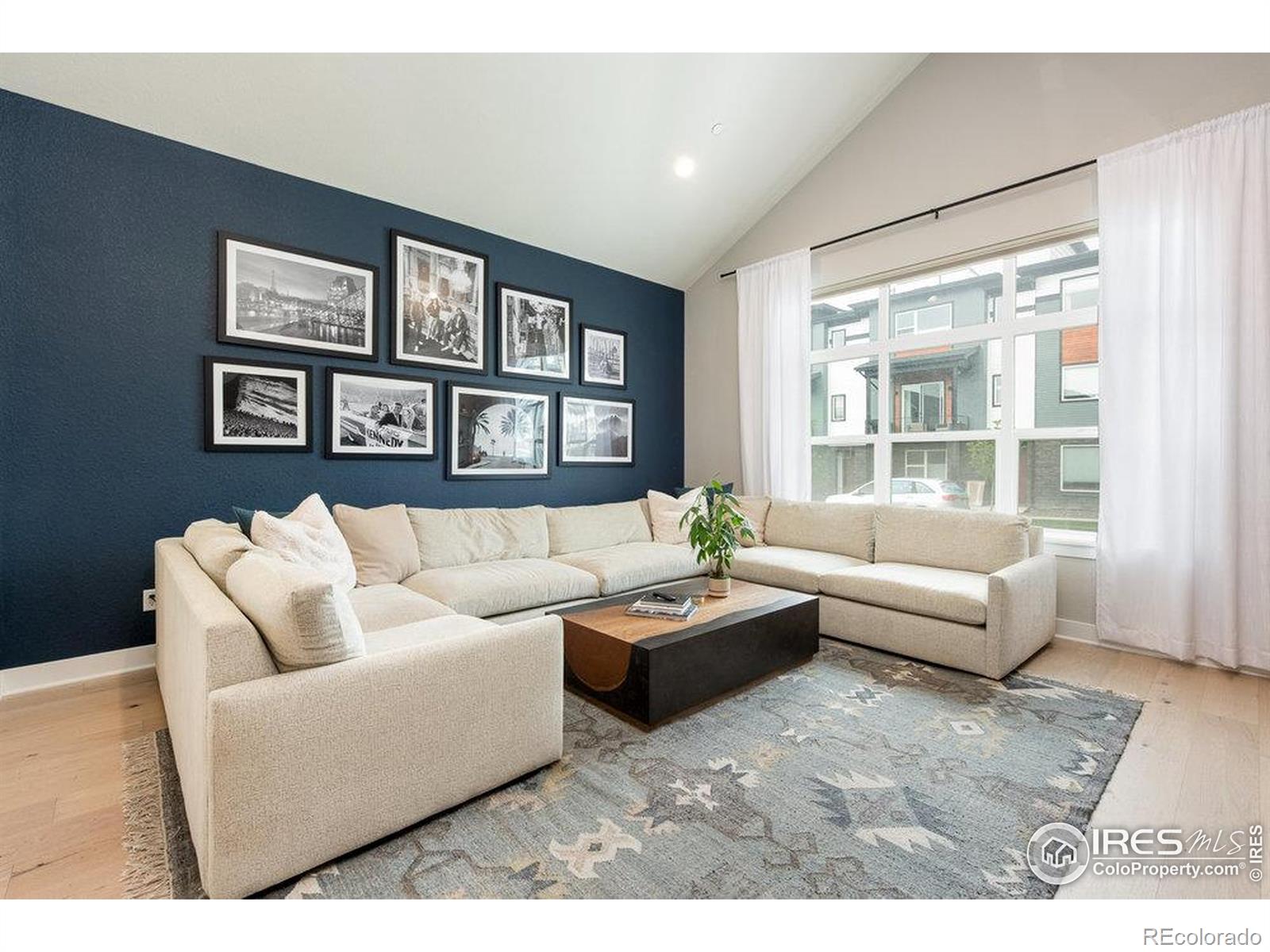 730 Promenade Drive Superior, CO 80027 - Photo 16 of 50 a living room with furniture and a large window