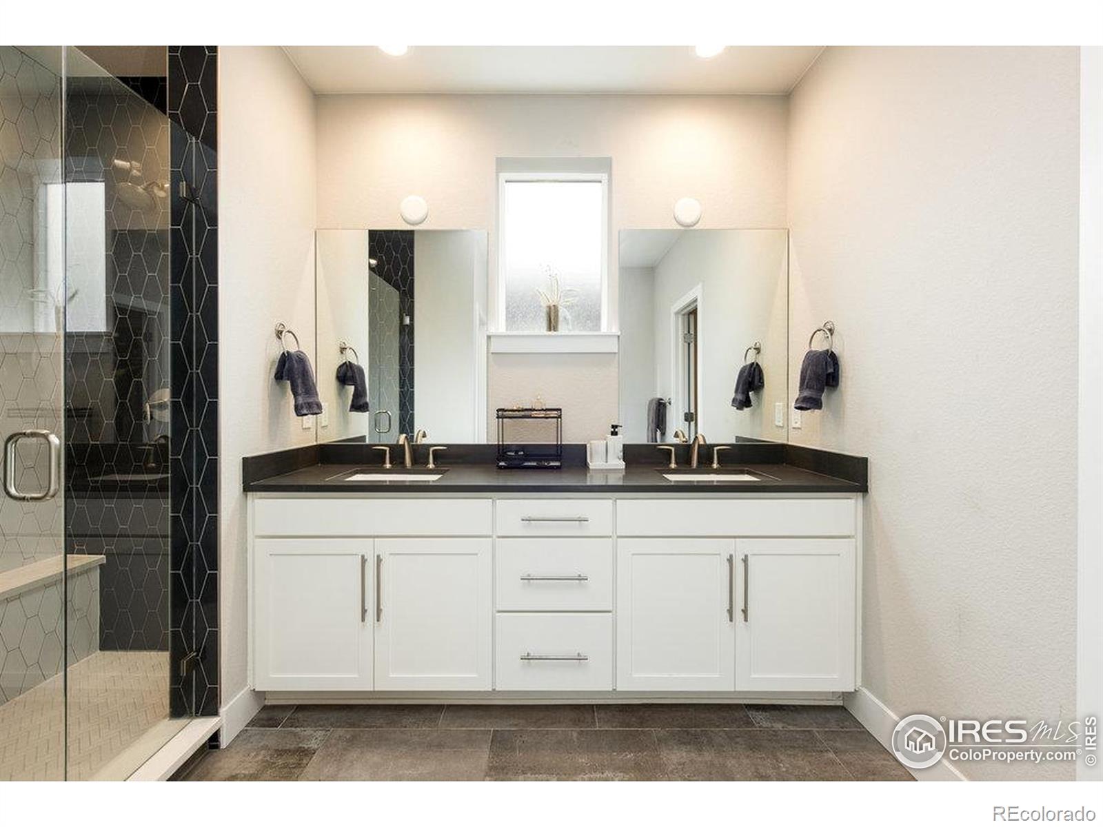 730 Promenade Drive Superior, CO 80027 - Photo 29 of 50 a bathroom with a sink and a mirror