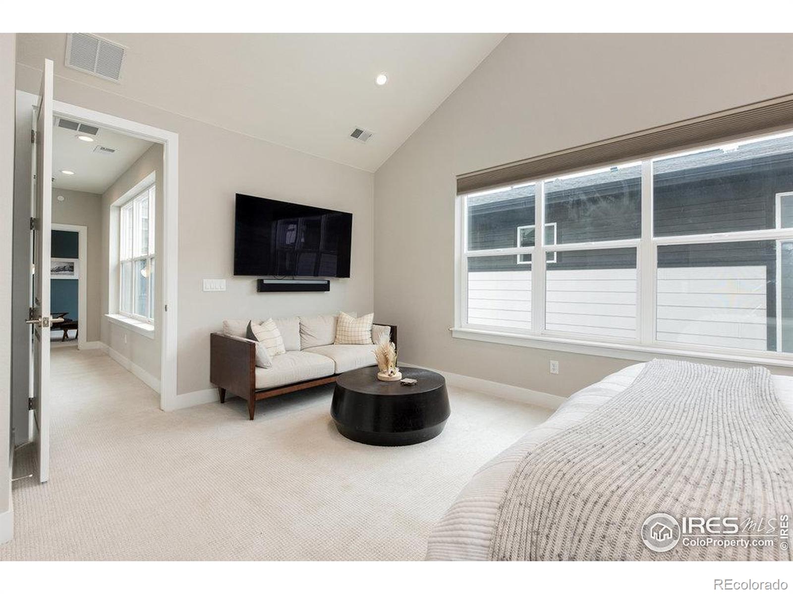 730 Promenade Drive Superior, CO 80027 - Photo 31 of 50 a living room with a couch and a flat screen tv